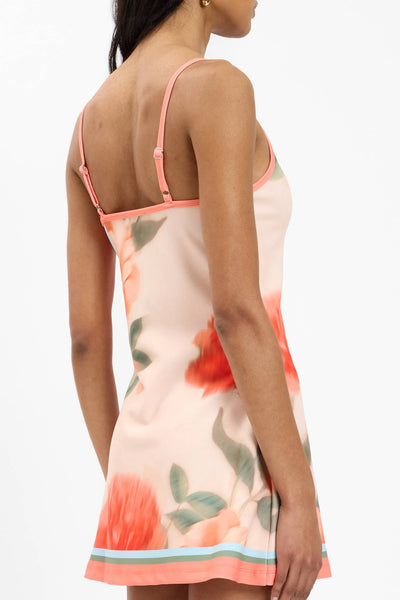 A detailed rear studio shot focusing on the upper back panel, showcasing the slider hardware on the narrow adjustable shoulder straps and the pattern continuity across the shoulders.