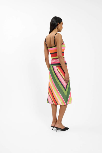 A detailed back-angle campaign image capturing the clean finish of the thin adjustable straps anchoring against a subtle low-cut back neckline.