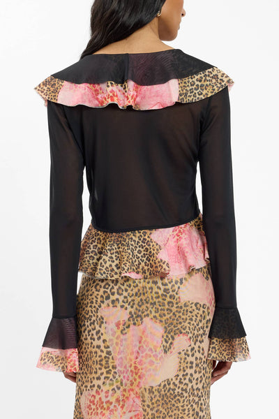 A close-up side angle focusing on the sleeve construction, illustrating the soft gather of the sheer polyester-elastane mesh fabric around the wrist.