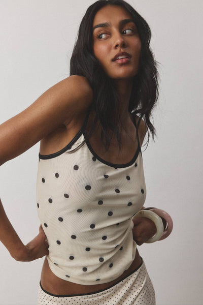 A three-quarter studio profile view of the mesh co-ord ensemble, demonstrating the high-stretch flexibility and fluid pattern integration across the body.