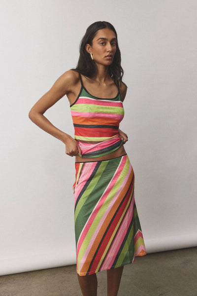 A three-quarter studio profile of the mesh co-ord ensemble, highlighting the high-stretch flexibility and fluid pattern matching from the camisole hem down through the hips.
