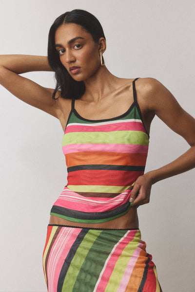 A full back view of the complete camisole and midi skirt outfit, demonstrating the sleek, hardware-free pull-over architecture of the garments.