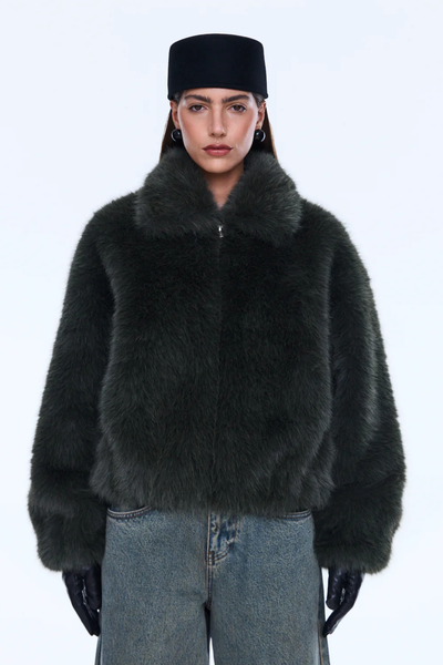Detailed view of the front highlighting the standard collar, silver-tone zipper, and discreet side seam pockets tucked into the faux fur.