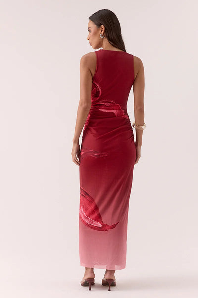 Full-length back view of a model wearing the Vere Florence high-neck midi dress in raspberry featured in a floral stretch mesh print.