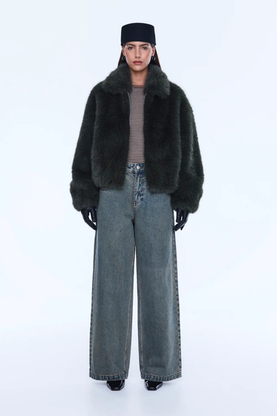 Model wearing the Daphne Bomber, showcasing the bold oversized silhouette and the internal elasticated hem that creates a rounded, structured shape.