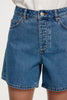 Close-up front view of the high-rise blue denim shorts, highlighting the button fly construction, belt loops, and classic five-pocket styling.