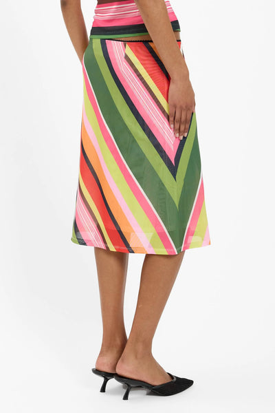 A studio image from the waist down focusing on the lower half of the skirt, illustrating the fluid movement, high-stretch recovery, and elegant midi length.