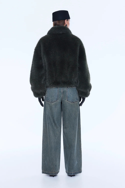Back profile of the olive bomber, showcasing the fully lined interior and the thick, insulating quality of the plush recycled polyester.