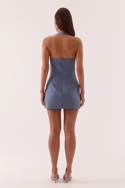 A three-quarter back studio view of the cocktail dress, demonstrating the clean fit of the invisible center-back zipper and the subtle gathers along the elasticated back top edge.