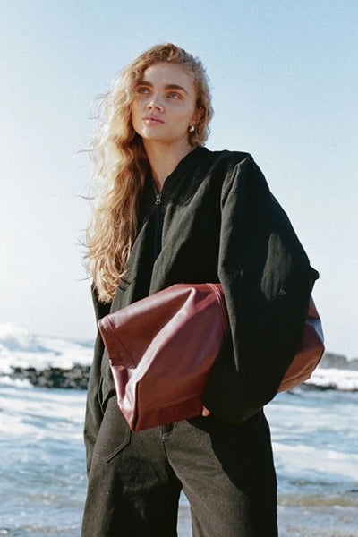 Model wearing the Wren Bomber, illustrating the relaxed, slightly oversized fit and the subtle structure provided by the internal wadding.