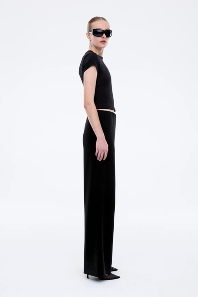 Rear view of the Alessa Relaxed Pants in black, showcasing the clean, pocket-free back and the consistent flow of the wide-leg cut.