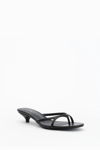 Side-front angle of the black tumble Alias Mae Bodie heeled sandal, highlighting the low kitten heel and delicate multi-strap upper.