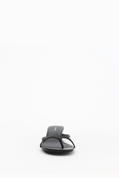 Direct front view of the Alias Mae Bodie slide-on sandal in black tumble leather, showing the minimal toe-loop construction and low-profile design.