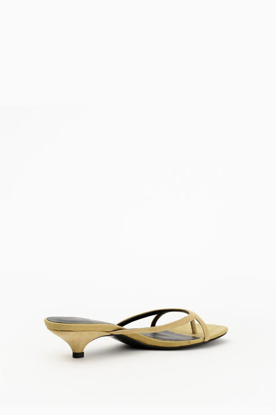 Medial side profile of the Alias Mae Bodie sandal in dune suede, displaying the subtle kitten heel and comfortable slide-on fit.