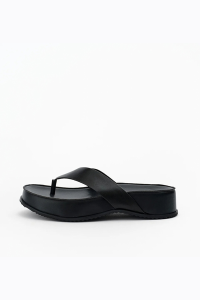 Side profile view of the black leather flatform sandal, displaying the even height of the 40mm platform and the textured rubber outsole.