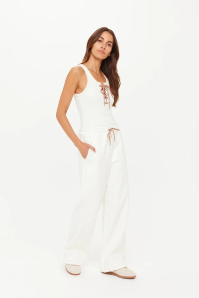 A front view of the high-rise Arkana Estelle Pant in cream, showcasing the relaxed barrel-shaped leg and the soft organic cotton terry fabrication.