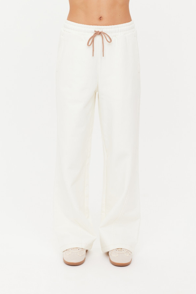 A front view of the high-rise Arkana Estelle Pant in cream, showcasing the relaxed barrel-shaped leg and the soft organic cotton terry fabrication.