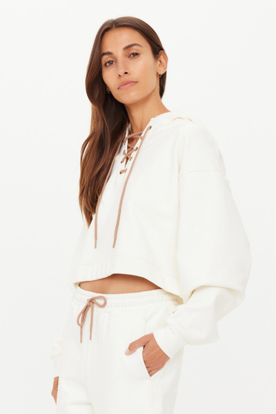 A side profile view showcasing the dropped shoulder design and the cropped 50cm length (size S) of the boxy silhouette.