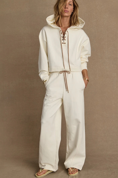A front view of the high-rise Arkana Estelle Pant in cream, showcasing the relaxed barrel-shaped leg and the soft organic cotton terry fabrication.