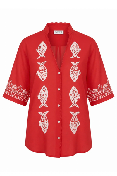 Flat product shot of the vibrant red 100% cotton blouse against a plain white background, showing the collar stand, V-neckline, shell buttons, and hand-embroidered white sardine and floral motifs.