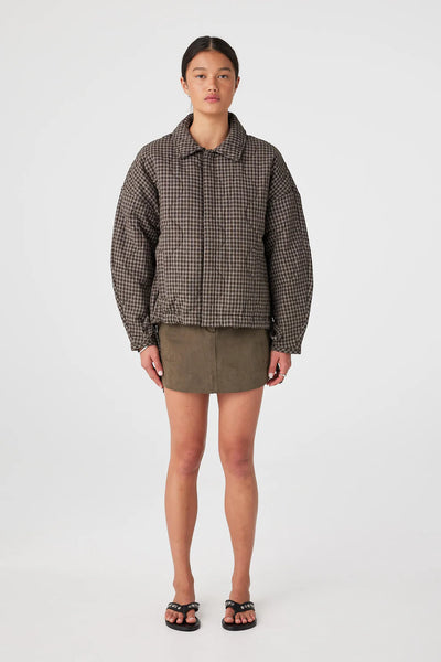 A full-length front view of the Matteo Jacket fully buttoned, demonstrating the clean look of the concealed button-down front.