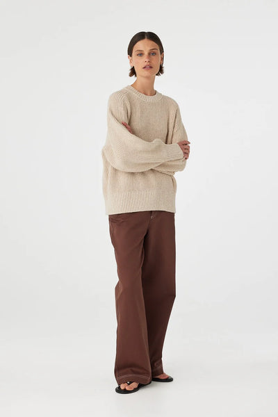 Model wearing the Solene sweater, illustrating the "naturally structured" oversized shape and the heavy-weight drape of the 100% cotton fabrication.