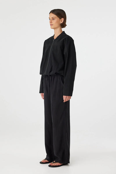 Rear view of the Rae Pant in black, showcasing the smooth, pocket-free back and the consistent straight-cut drape from the waist to the hem.
