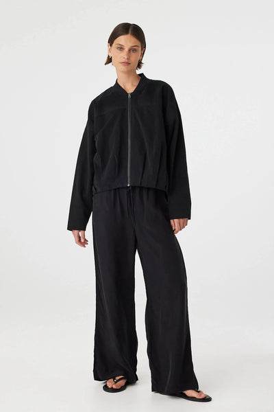 Model wearing the Wren Bomber, illustrating the relaxed, slightly oversized fit and the subtle structure provided by the internal wadding.