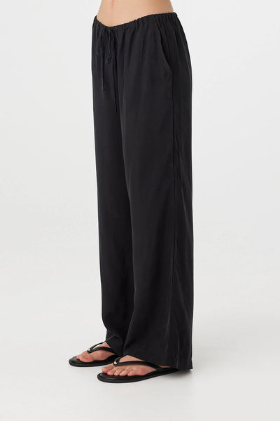 Black Rae Pants featuring a relaxed straight-leg silhouette and a comfortable elasticated waistband with an adjustable drawcord.