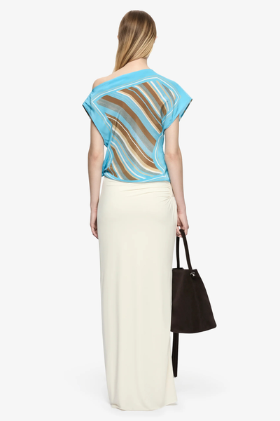 Full-body back view of the Elaris Drape Top showing the back drape and asymmetric cut.