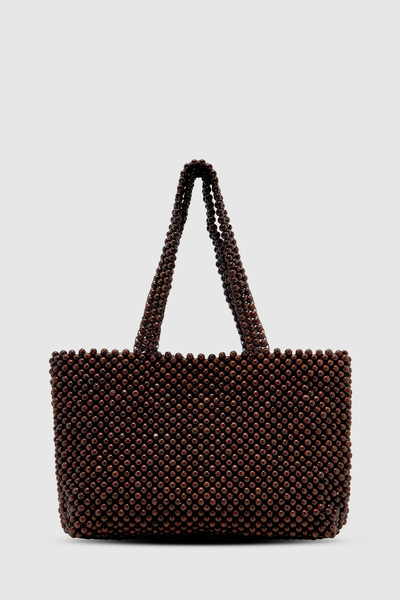 Studio front-facing product shot of the spacious dark chocolate lotus wood beaded tote bag against a clean white background.