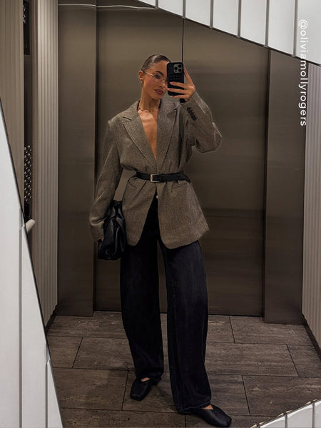 Full-length mirror selfie of a model wearing Senso Brynn high-cut ballet flats in ebony leather, styled with wide-leg dark denim and a belted grey tweed blazer.
