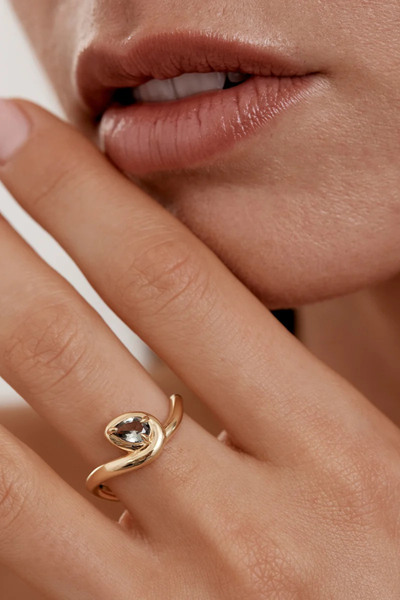 On-model detail view of the By Charlotte Embrace Growth Ring in 18k Gold Vermeil worn on the index finger.