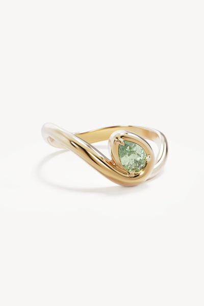 Studio product shot of the By Charlotte Embrace Growth Ring in 18k Gold Vermeil on a clean white background, highlighting the polished gold vermeil finish and green gemstone setting.