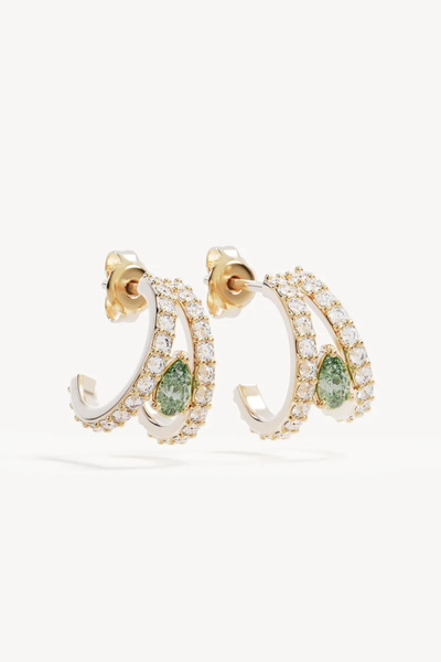 Studio product shot of the By Charlotte Aura Illusion Hoops in 18k Gold Plated, showing a pair of double-banded illusion open hoops embellished with round cubic zirconias and a central pear-cut lab-grown green tourmaline.