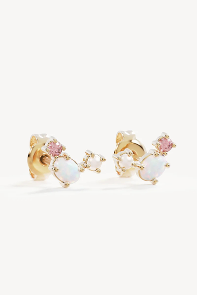 Studio product shot of the By Charlotte Cosmic Bloom Stud Earrings in 18k Gold Vermeil, showing the mirrored pair set with round pink cubic zirconia, oval lab-grown opal, and freshwater pearl.