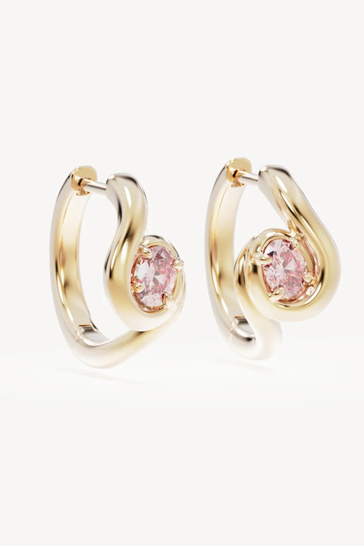 Studio product shot of the By Charlotte Embrace Love Hoops in 18k Gold Vermeil, showing the mirrored pair of 10mm polished gold huggie hoops set with oval-cut pink cubic zirconia stones.