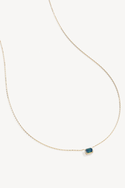 Studio product shot of the By Charlotte Trust Your Intuition Necklace in 18k Gold Vermeil, featuring a fine diamond-cut cable chain and an emerald-cut deep green nano tourmaline Paraiba pendant.