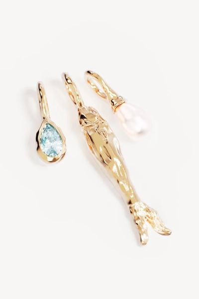 Infuses your image metadata with organic search terms like "18k gold plated charm necklace," "anchovy fish charm pendant," and "gold pearl and gemstone talisman."