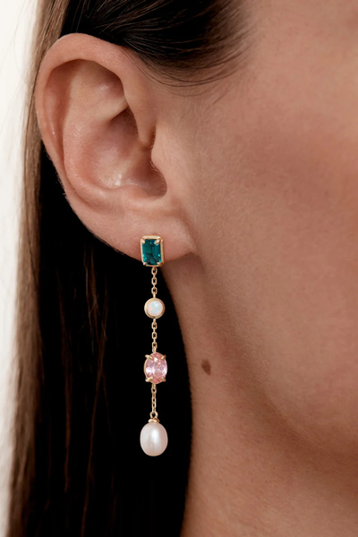 On-model lifestyle view demonstrating the By Charlotte You Are Infinite Drop Chain Earring in 18k Gold Plated worn in an earlobe piercing, showing the full length of the 5cm gemstone drop.
