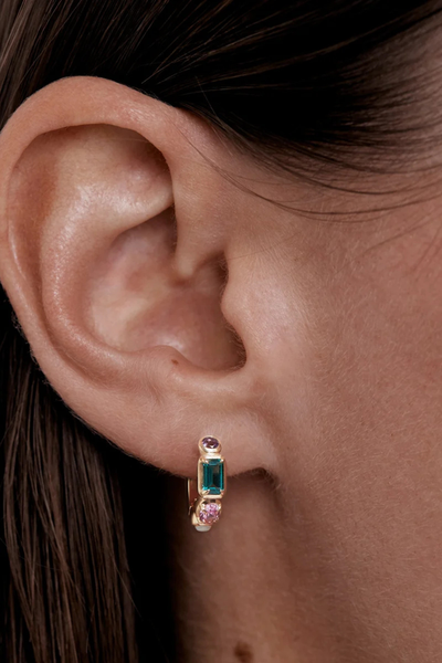 On-model lifestyle detail view showing the By Charlotte You Are Infinite Hoop in 18k Gold Plated styled in an earlobe piercing.