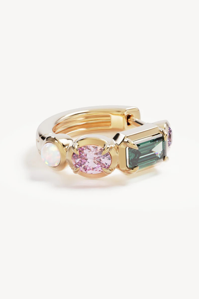 Macro close-up shot of a single By Charlotte You Are Infinite Hoop in 18k Gold Plated laid flat, highlighting the multi-gemstone settings and polished finish.