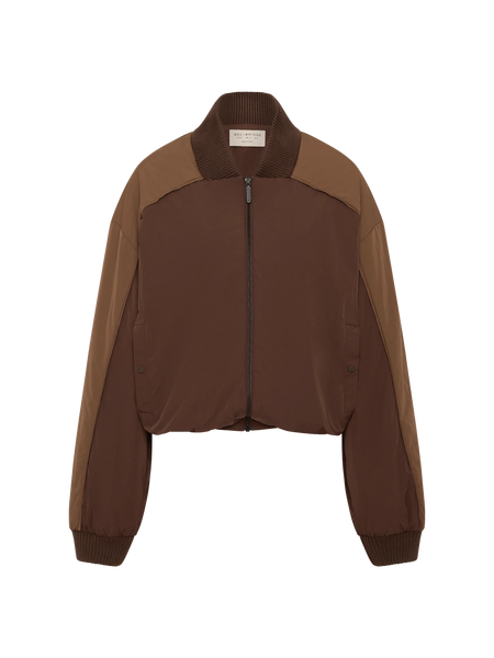 Front view product studio shot of the Bec + Bridge Laney Jacket in Choc/Coffee nylon padded bomber featuring contrast panelling, ribbed collar, and snap-button welt pockets.
