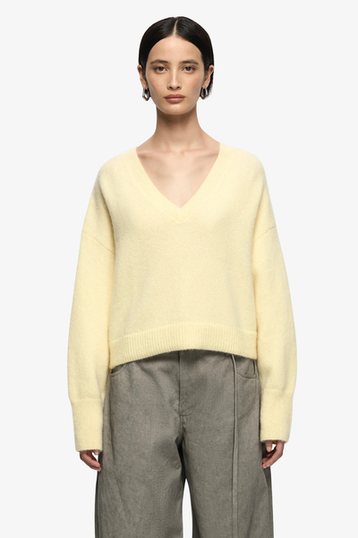 Model wearing the Campbell jumper, illustrating the "slouchy" oversized fit and how the cropped hem sits perfectly above the waistline.