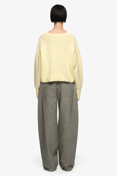 Back profile highlighting the airy, fluffy texture of the mohair-wool blend and the modern, shortened length of the garment.