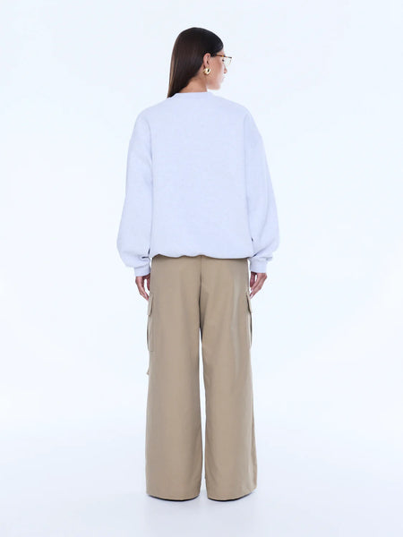 Back profile highlighting the heavy-weight fleece drape and the premium blend of organic and recycled cotton.
