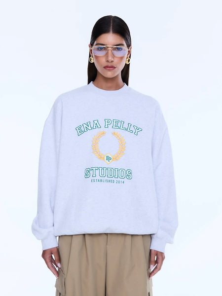 Model wearing the Mila sweater, illustrating the relaxed crew neck, dropped shoulders, and the generous, voluminous oversized fit on a 176cm frame.