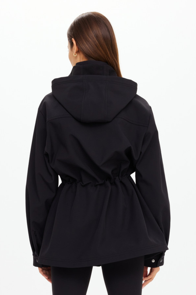 Full back view of the black Freddie Anorak, emphasizing the flattering gathered waist and the clean, minimalist lines of the weather-resistant shell.