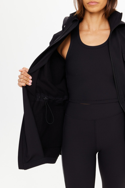 Detailed interior shot showing the soft, insulating black fleece lining and the internal drawcord toggle for an adjustable waist fit.