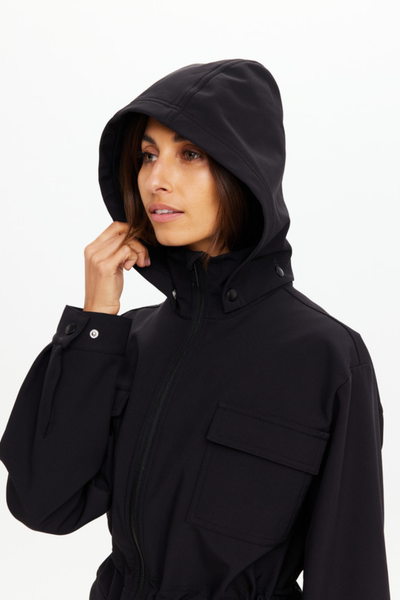 Close-up front profile focusing on the protective high-zip neckline and the tonal branded hardware on the adjustable hood.